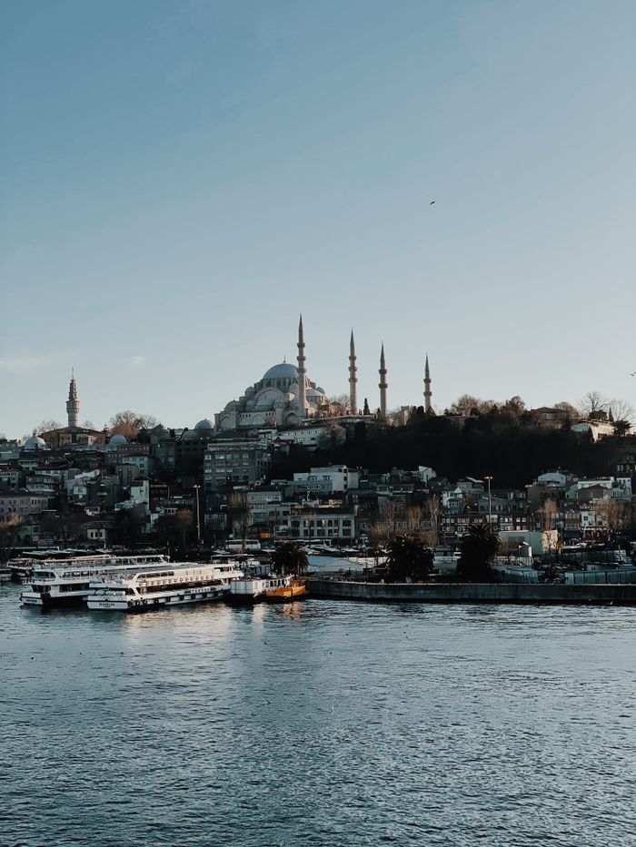 Iconic view of Süleymaniye Mosque and Bosphorus, capturing Istanbul's historic skyline and waterway.